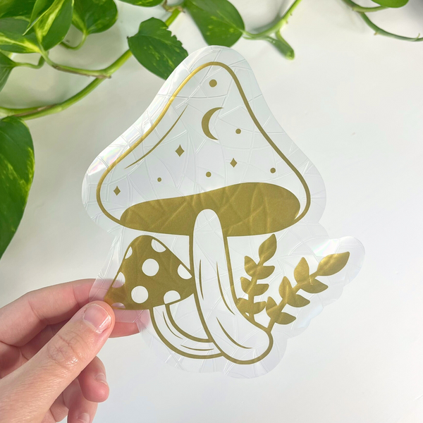 Whimsical Celestial Mushroom Suncatcher reflecting sunlight